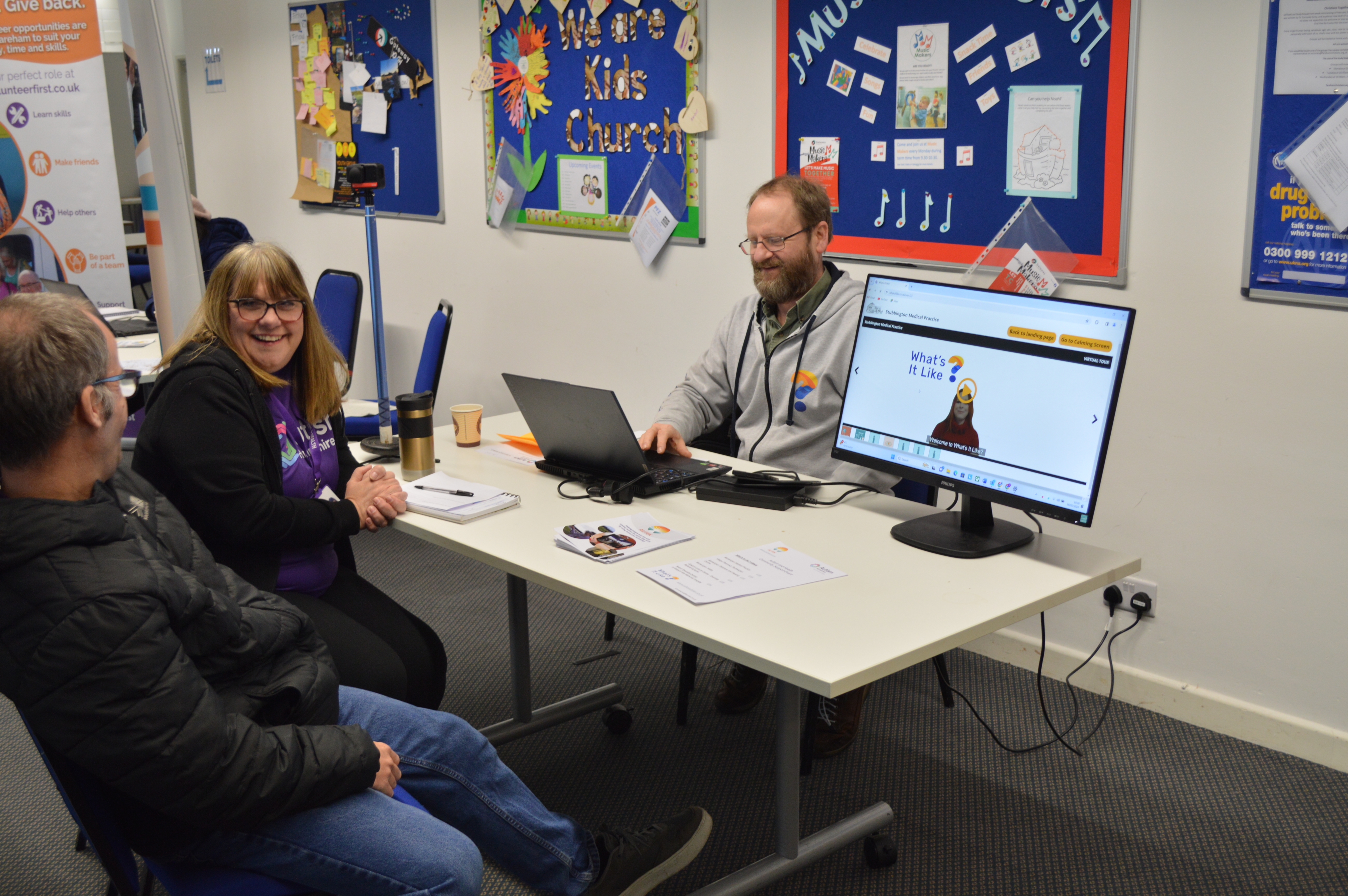 Autism and Health team talking to Autek at a recent event