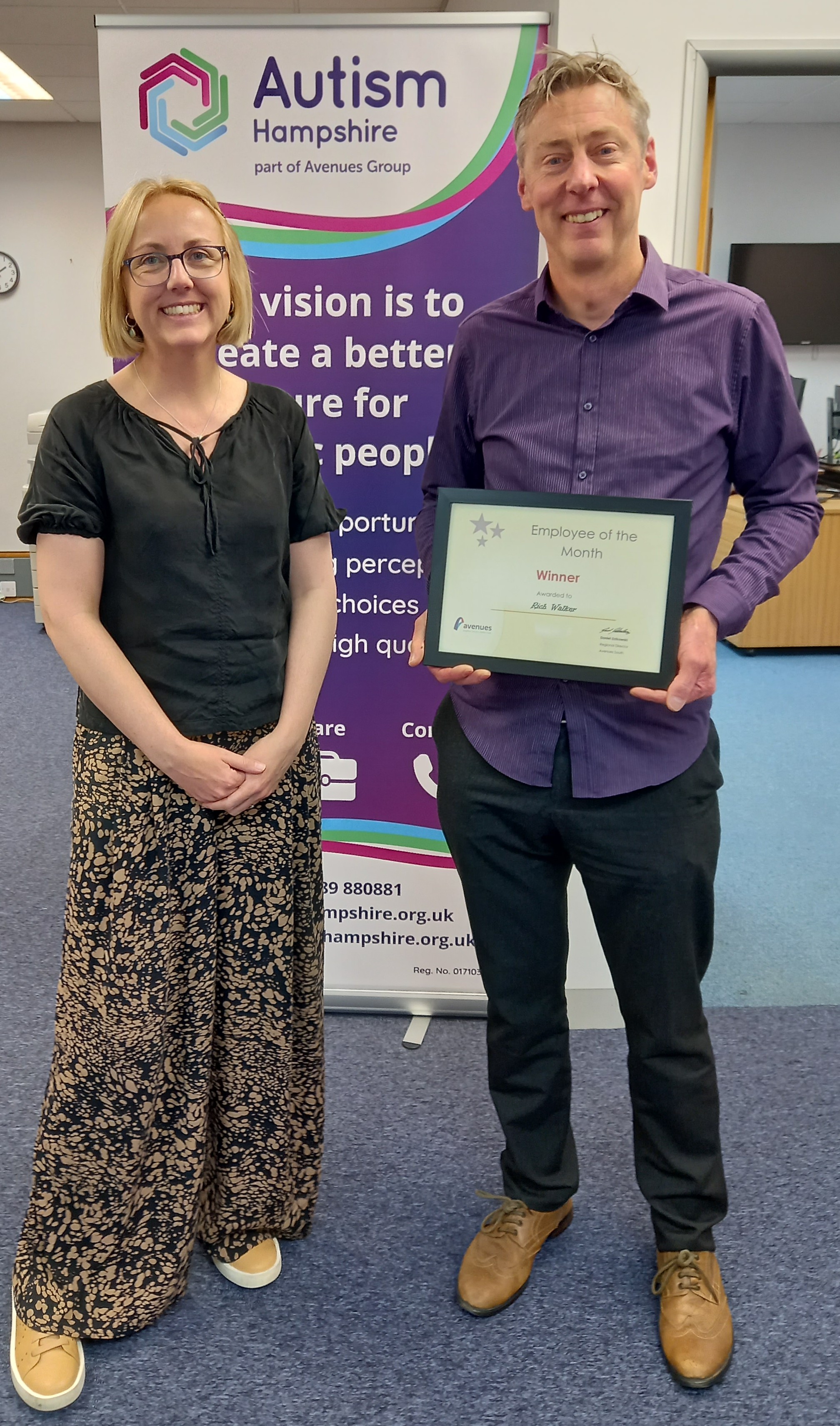Cheryl Claxton and Rich Walker receiving his certificate