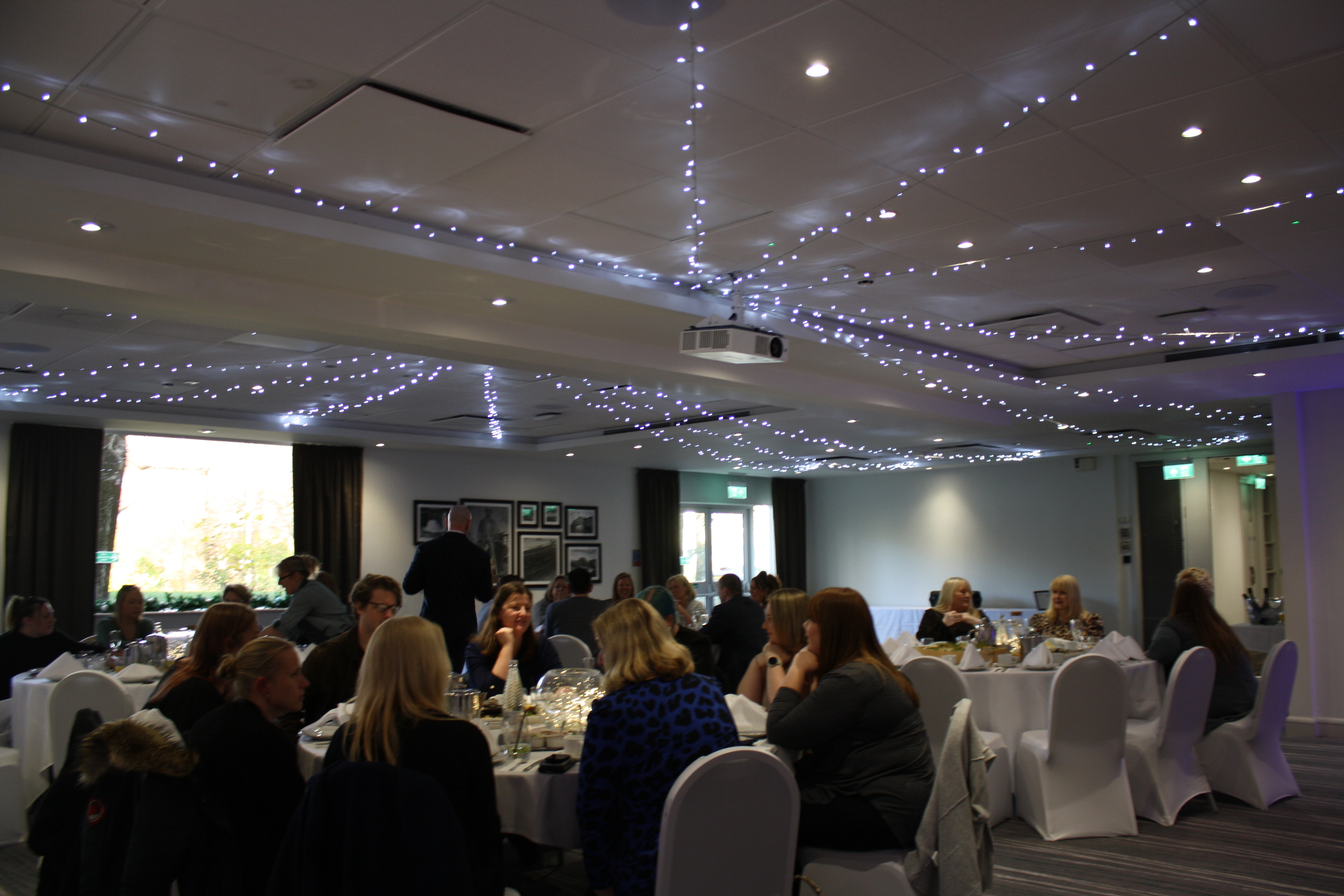 Colleagues enjoy an afternoon event celebrating their achievements.