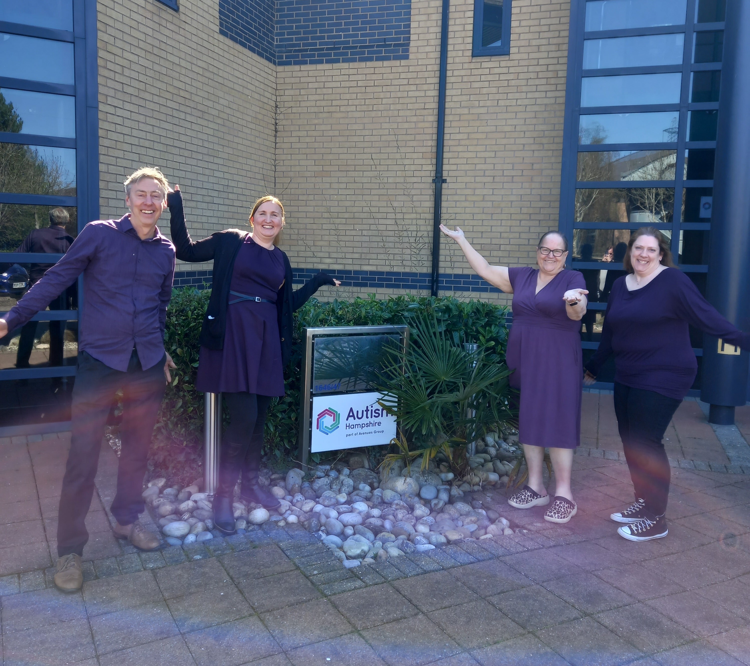 Colleagues at the office wearing purple for World Autism Awareness Day.