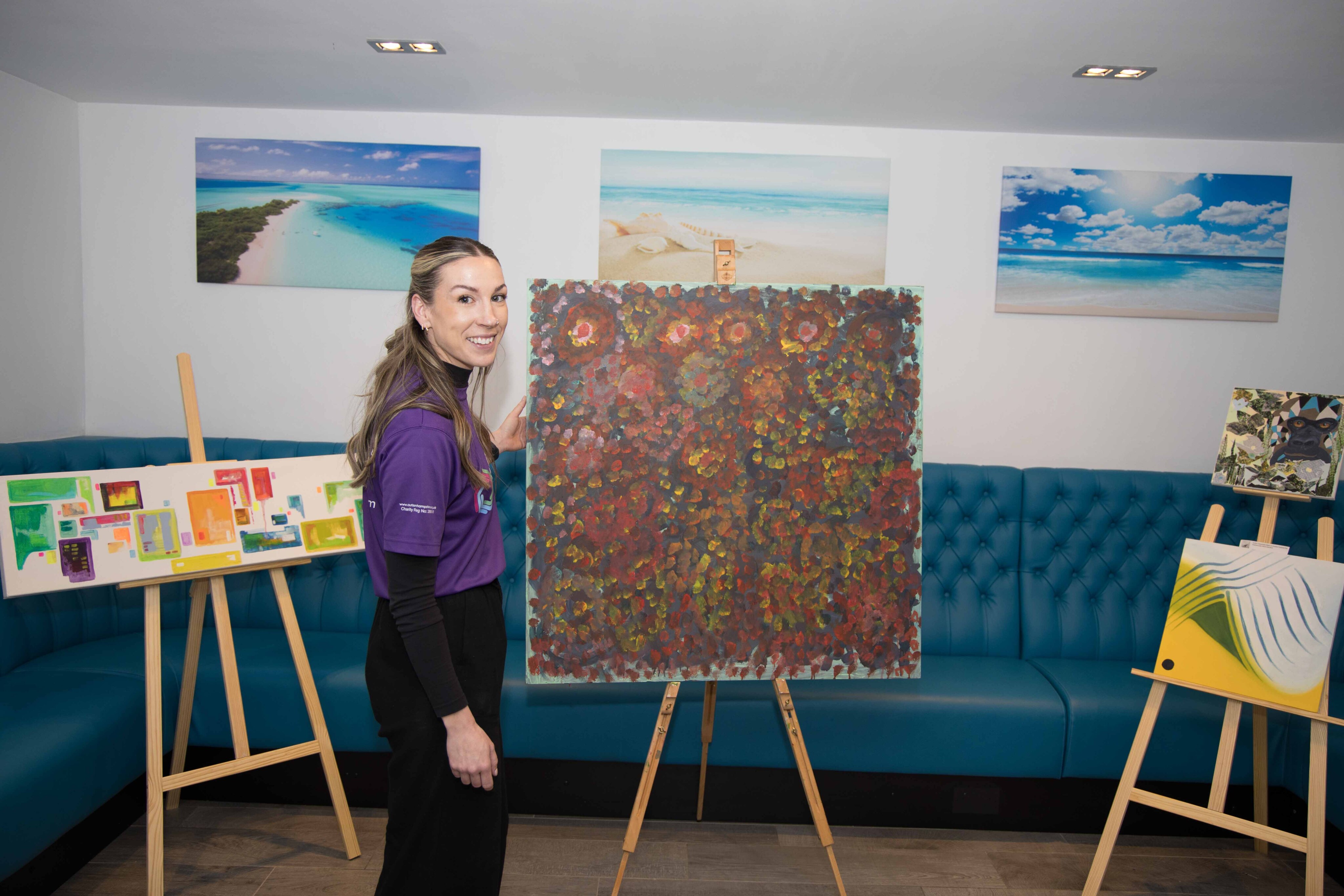 Lauren with art on display at the exhibition - credit John Morley Photography