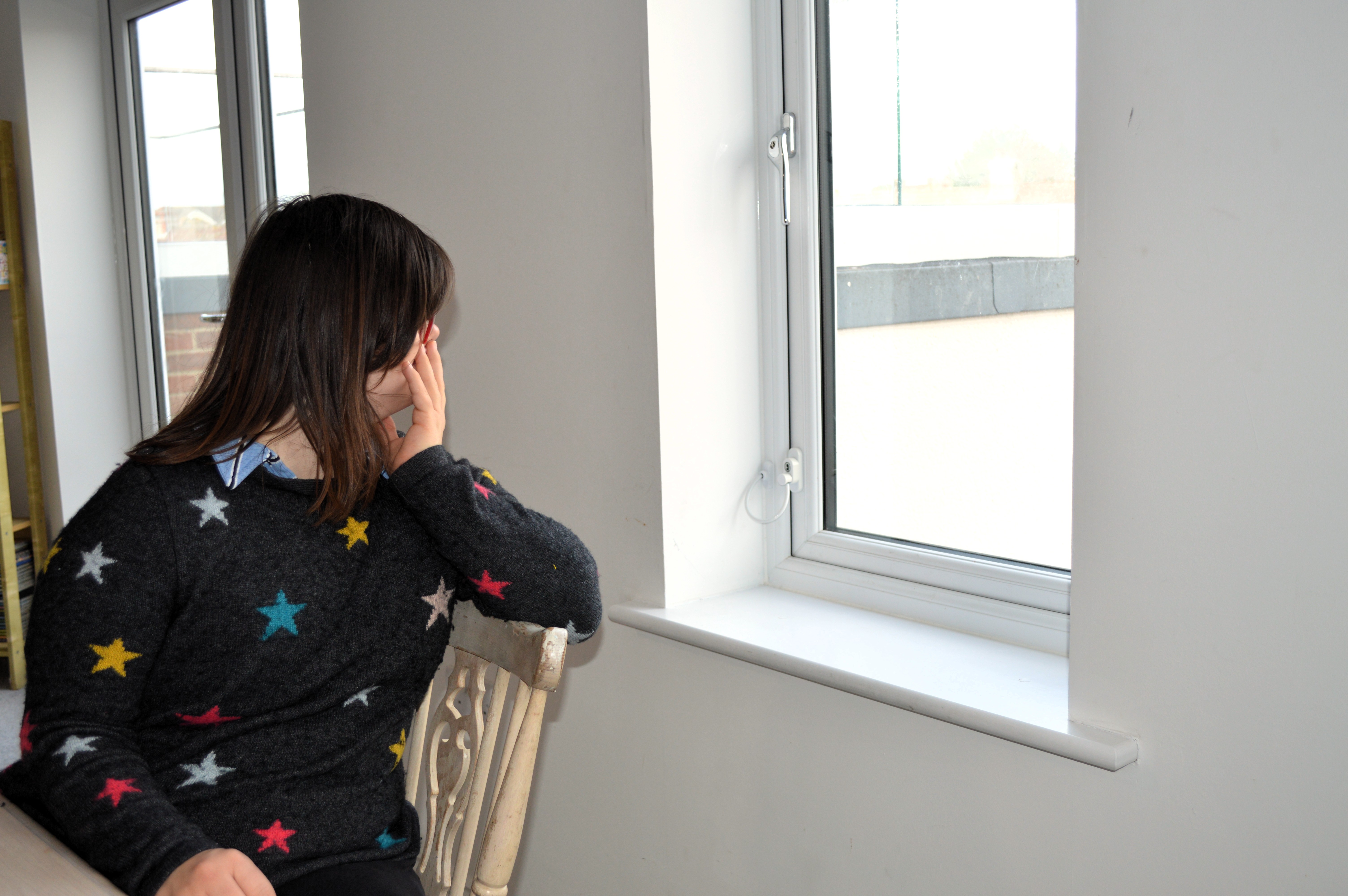 Rhi enjoying the view in her apartment.