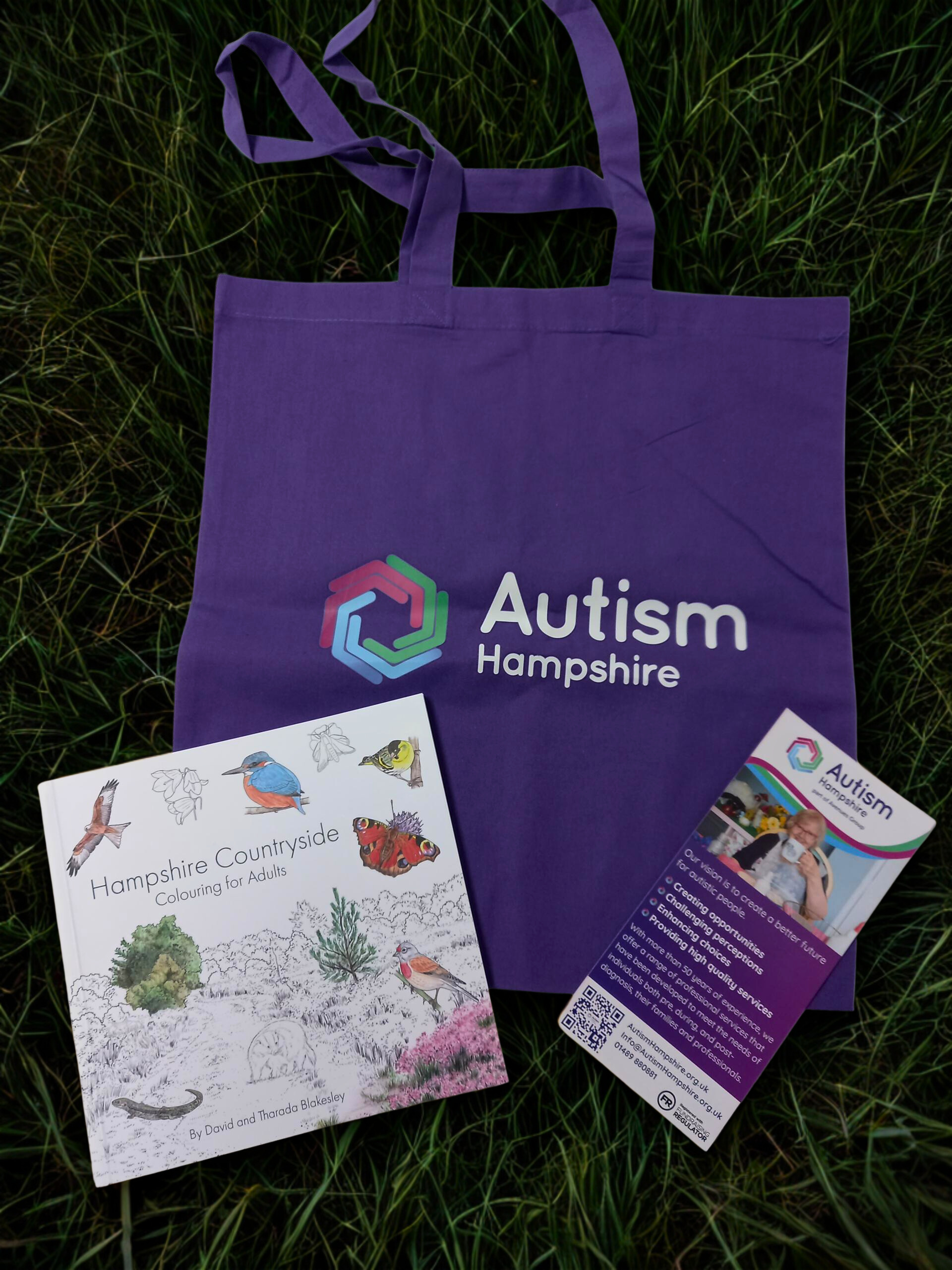 Photo of the tote bag, colouring book and leaflet