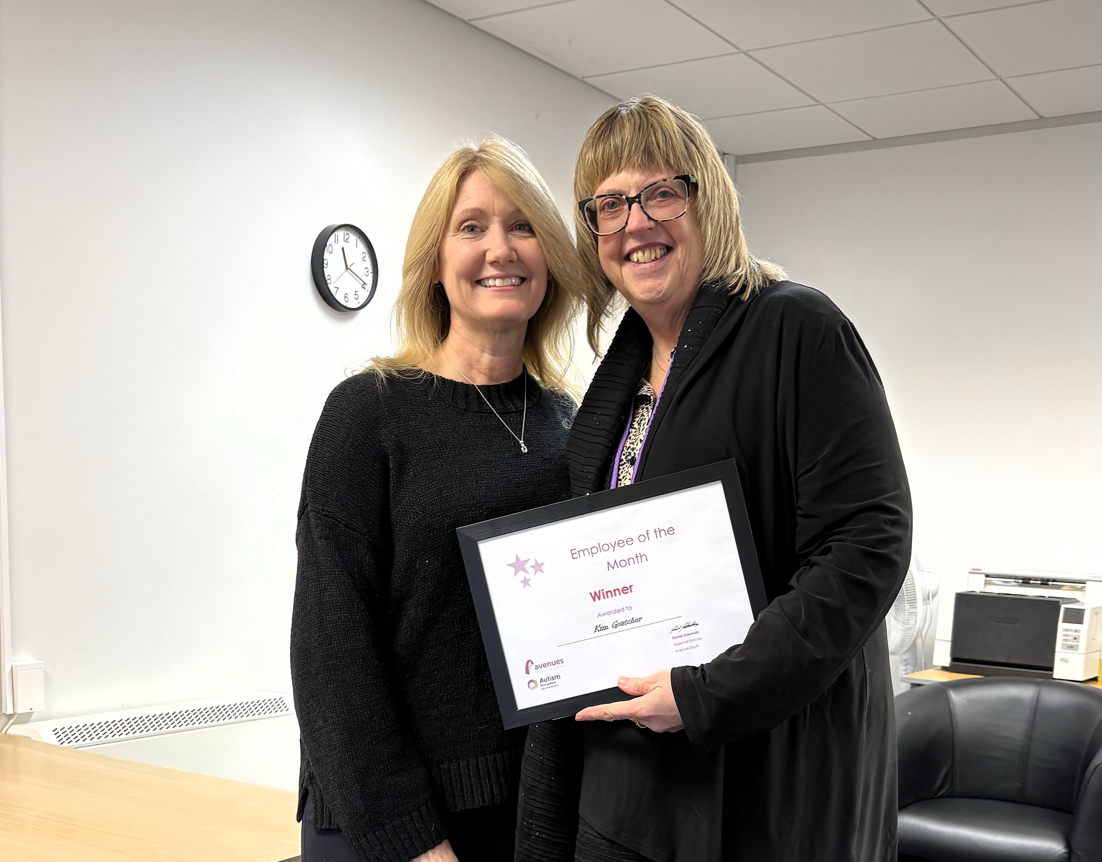 Kim with her manager Danielle receiving her award certificate